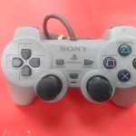 MANETTE PLAYSTATION 1 / GRIS