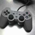 MANETTE PLAYSTATION 1 / GRIS